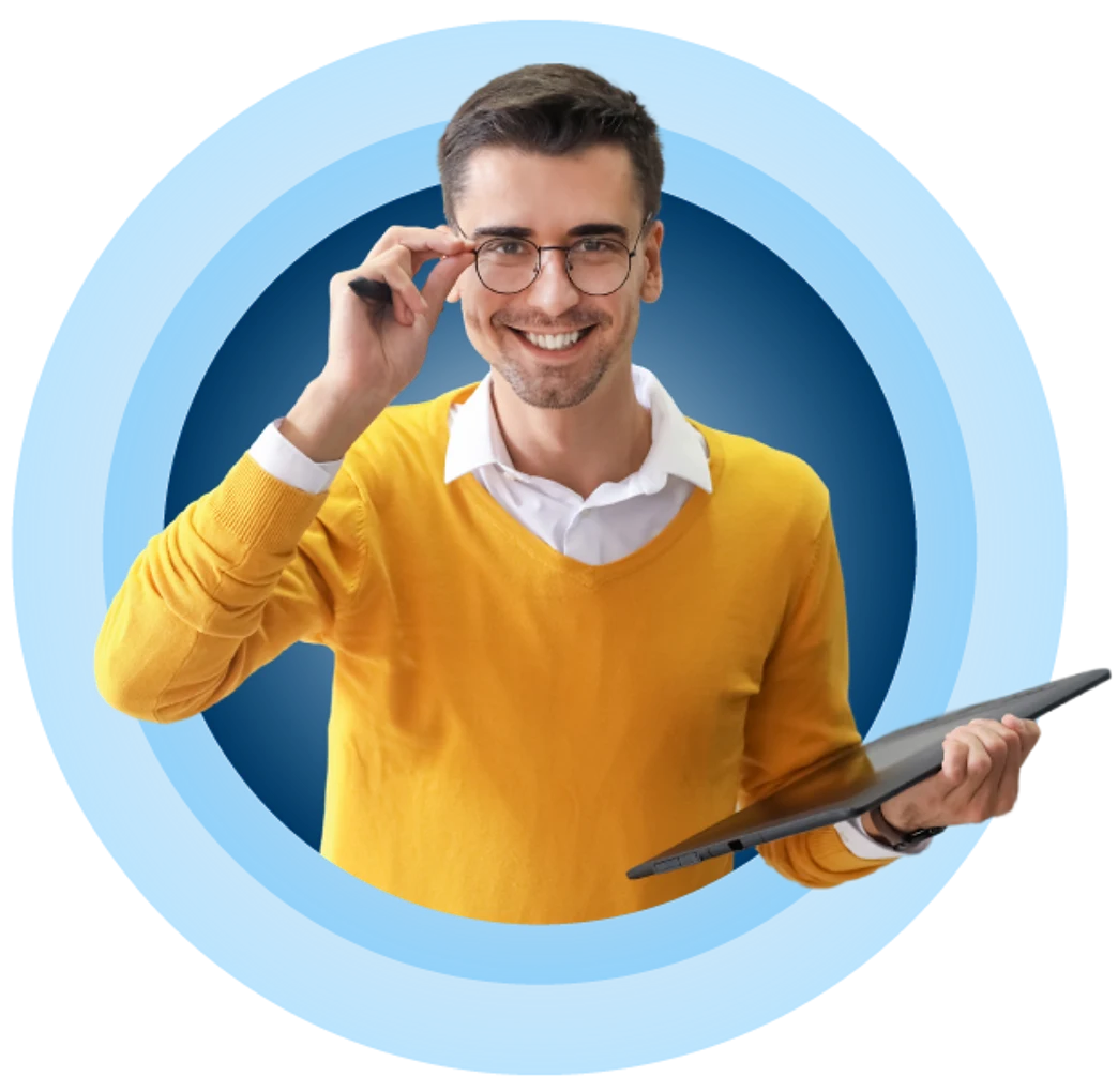 Smiling man in a yellow sweater holding a tablet