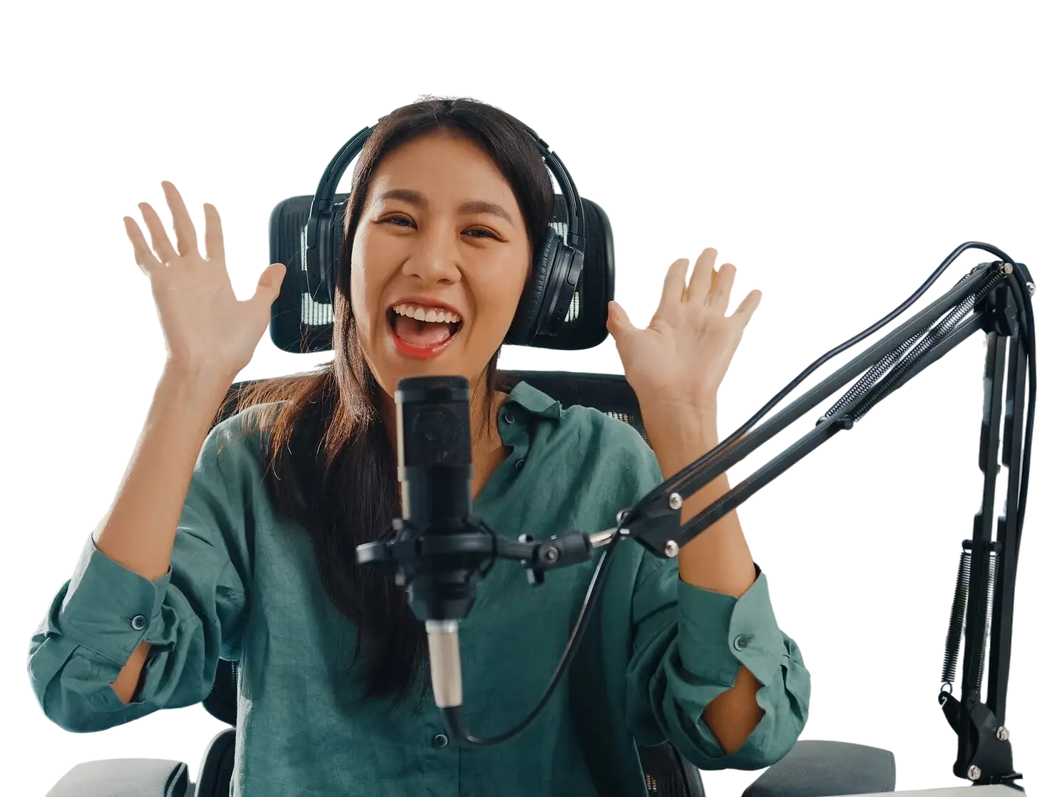 Excited woman recording a podcast with a microphone and headphones